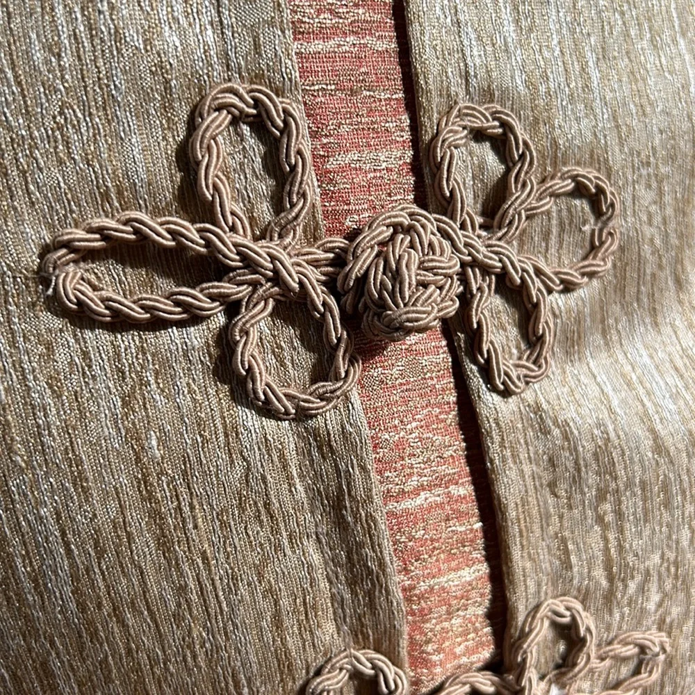 Unbranded braided cord accent pillow. Approximately 16” square.